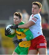 5 February 2023; Jamie Brennan of Donegal in action against Michael McKernan of Tyrone during the Allianz Football League Division 1 match between Tyrone and Donegal at O'Neill's Healy Park in Omagh, Tyrone. Photo by Ramsey Cardy/Sportsfile