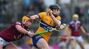 5 February 2023; David McInerney of Clare is tackled by Davy Glennon of Westmeath during the Allianz Hurling League Division 1 Group A match between Clare and Westmeath at Cusack Park in Ennis, Clare. Photo by Ray McManus/Sportsfile