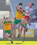 5 February 2023; Brian Kennedy of Tyrone in action against Jason McGee of Donegal during the Allianz Football League Division 1 match between Tyrone and Donegal at O'Neill's Healy Park in Omagh, Tyrone. Photo by Ramsey Cardy/Sportsfile
