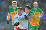 5 February 2023; Peter Harte of Tyrone is tackled by Martin O'Reilly of Donegal during the Allianz Football League Division 1 match between Tyrone and Donegal at O'Neill's Healy Park in Omagh, Tyrone. Photo by Ramsey Cardy/Sportsfile