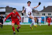 5 February 2023; Charlie Quinn of Galway District League in action against Sean Connolly of Cork Youth League during the FAI Youth Inter-League Cup Final 2023 match between Galway District League and Cork Youth League at Eamonn Deacy Park in Galway. Photo by Tyler Miller/Sportsfile