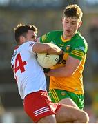 5 February 2023; Darren McCurry of Tyrone in action against Mark Curran of Donegal during the Allianz Football League Division 1 match between Tyrone and Donegal at O'Neill's Healy Park in Omagh, Tyrone. Photo by Ramsey Cardy/Sportsfile