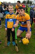 5 February 2023; Eight year old Daniel Kelly, from Scarriff, poses with his cousin Mark Rodgers of Clare after the Allianz Hurling League Division 1 Group A match between Clare and Westmeath at Cusack Park in Ennis, Clare. Photo by Ray McManus/Sportsfile