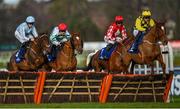 5 February 2023; State Man, right, with Paul Townend up, leads the field over the first on their way to winning the Chanelle Pharma Irish Champion Hurdle, from eventual second place Honeysuckle, left, with Rachael Blackmore up, on day two of the Dublin Racing Festival at Leopardstown Racecourse in Dublin. Photo by Seb Daly/Sportsfile