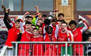 5 February 2023; Harvey Skeiters of Cork Youth League lifts the trophy after the FAI Youth Inter-League Cup Final 2023 match between Galway District League and Cork Youth League at Eamonn Deacy Park in Galway. Photo by Tyler Miller/Sportsfile