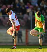5 February 2023; Darren McCurry of Tyrone and Mark Curran of Donegal clean grass from their studs during the Allianz Football League Division 1 match between Tyrone and Donegal at O'Neill's Healy Park in Omagh, Tyrone. Photo by Ramsey Cardy/Sportsfile