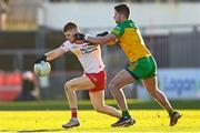 5 February 2023; Cathal McShane of Tyrone in action against Brendan McCole of Donegal during the Allianz Football League Division 1 match between Tyrone and Donegal at O'Neill's Healy Park in Omagh, Tyrone. Photo by Ramsey Cardy/Sportsfile