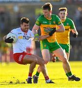 5 February 2023; Darren McCurry of Tyrone in action against Mark Curran of Donegal during the Allianz Football League Division 1 match between Tyrone and Donegal at O'Neill's Healy Park in Omagh, Tyrone. Photo by Ramsey Cardy/Sportsfile