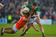5 February 2023; Jordan Flynn of Mayo is tackled by Jemar Hall of Armagh during the Allianz Football League Division 1 match between Armagh and Mayo at Box-It Athletic Grounds in Armagh. Photo by Brendan Moran/Sportsfile