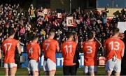 5 February 2023; The Armagh players applaud in support of the family of the late Natalie McNally, who was murdered in Lurgan, Co Armagh in December last, before the Allianz Football League Division 1 match between Armagh and Mayo at Box-It Athletic Grounds in Armagh. Photo by Brendan Moran/Sportsfile