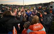 5 February 2023; Armagh goalkeeper Ethan Rafferty poses for selfies with supporters after the Allianz Football League Division 1 match between Armagh and Mayo at Box-It Athletic Grounds in Armagh. Photo by Brendan Moran/Sportsfile
