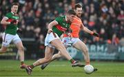 5 February 2023; Jordan Flynn of Mayo shoots for goal despite the efforts of Callum Cumiskey of Armagh during the Allianz Football League Division 1 match between Armagh and Mayo at Box-It Athletic Grounds in Armagh. Photo by Brendan Moran/Sportsfile