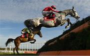 5 February 2023; Dunvegan, with Bryan Cooper up, jumps the first during the Ladbrokes Dublin Steeplechase on day two of the Dublin Racing Festival at Leopardstown Racecourse in Dublin. Photo by Seb Daly/Sportsfile