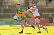 5 February 2023; Jeaic McKelvey of Donegal in action against Frank Burns of Tyrone during the Allianz Football League Division 1 match between Tyrone and Donegal at O'Neill's Healy Park in Omagh, Tyrone. Photo by Ramsey Cardy/Sportsfile