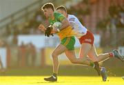5 February 2023; Daire O'Baoill of Donegal is tackled by Brian Kennedy of Tyrone during the Allianz Football League Division 1 match between Tyrone and Donegal at O'Neill's Healy Park in Omagh, Tyrone. Photo by Ramsey Cardy/Sportsfile