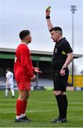 5 February 2023; Sean Connolly of Cork Youth League is shown a yellow card from referee Paudie Hayes during the FAI Youth Inter-League Cup Final 2023 match between Galway District League and Cork Youth League at Eamonn Deacy Park in Galway. Photo by Tyler Miller/Sportsfile