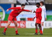 5 February 2023; Harvey Skeiters of Cork Youth League, right, is congratulated by his teammate Eric Cunningham after scoring his sdie's third goal during the FAI Youth Inter-League Cup Final 2023 match between Galway District League and Cork Youth League at Eamonn Deacy Park in Galway. Photo by Tyler Miller/Sportsfile