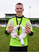 5 February 2023; Cork Youth League goalkeeper Robert Barry celebrates his side's victory by showing his gloves dedicated to his grand-uncle Der Murphy after the FAI Youth Inter-League Cup Final 2023 match between Galway District League and Cork Youth League at Eamonn Deacy Park in Galway. Photo by Tyler Miller/Sportsfile