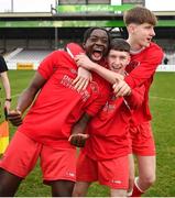 5 February 2023; Cork Youth League players, from left, Faraq Adegboyega, Darragh O'Shea, and Ben Heinen celebrate after their side's victory in the FAI Youth Inter-League Cup Final 2023 match between Galway District League and Cork Youth League at Eamonn Deacy Park in Galway. Photo by Tyler Miller/Sportsfile