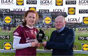 6 February 2023; Kate Slevin of Galway is presented with the Player of the Match award by Caolan O Broin, Deputy Store Manager, Lidl Navan, following the 2023 Lidl Ladies National Football League Division 1 Round 3 between Galway and Meath at Páirc Tailteann in Navan, Meath. Photo by Piaras Ó Mídheach/Sportsfile