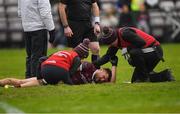 5 February 2023; Damien Comer of Galway receives medical attention after picking up an injury during the Allianz Football League Division 1 match between Galway and Roscommon at Pearse Stadium in Galway. Photo by Ray Ryan/Sportsfile