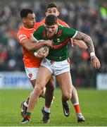5 February 2023; Jordan Flynn of Mayo is tackled by Jemar Hall of Armagh during the Allianz Football League Division 1 match between Armagh and Mayo at Box-It Athletic Grounds in Armagh. Photo by Brendan Moran/Sportsfile