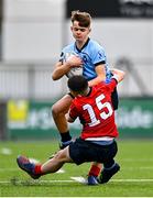 7 February 2023; Josh Divilly of St Michael's College is tackled by Daniel Clarke of CUS during the Bank of Ireland Leinster Rugby Schools Junior Cup First Round match between St Michael’s College and CUS at Energia Park in Dublin. Photo by Ben McShane/Sportsfile