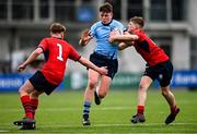 7 February 2023; Joe Kennedy of St Michael's College in action against Benn Cunningham, left, and David Ginnelly of CUS during the Bank of Ireland Leinster Rugby Schools Junior Cup First Round match between St Michael’s College and CUS at Energia Park in Dublin. Photo by Ben McShane/Sportsfile