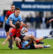 7 February 2023; Andrew Maguire of CUS is tackled by Owen Twomey of St Michael's College during the Bank of Ireland Leinster Rugby Schools Junior Cup First Round match between St Michael’s College and CUS at Energia Park in Dublin. Photo by Ben McShane/Sportsfile
