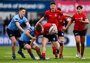 7 February 2023; Andrew Maguire of CUS is tackled by Owen Twomey of St Michael's College during the Bank of Ireland Leinster Rugby Schools Junior Cup First Round match between St Michael’s College and CUS at Energia Park in Dublin. Photo by Ben McShane/Sportsfile