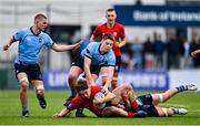 7 February 2023; Andrew Maguire of CUS is tackled by Owen Twomey of St Michael's College during the Bank of Ireland Leinster Rugby Schools Junior Cup First Round match between St Michael’s College and CUS at Energia Park in Dublin. Photo by Ben McShane/Sportsfile