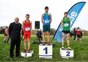 8 February 2023; Athletics Ireland Chief Executive Hamish Adams with the Intermediate boys podium, first place Noah Harris of ETSS Wicklow, centre, second place Conor Sherwin of Colaiste Mhuire Mullingar, right, and third place Tom Breslin of St Aidan's C.B.S. during the 123.ie Leinster Schools Cross Country 2023 at Santry Demesne in Dublin. Photo by David Fitzgerald/Sportsfile