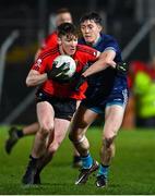 8 February 2023; Ruairi Murphy of University College Cork is tackled by Killian McGinnis of Technological University Dublin during the Electric Ireland HE GAA Sigerson Cup Semi-Final match between TU Dublin and UCC at Netwatch Cullen Park in Carlow. Photo by Ben McShane/Sportsfile