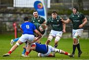 10 February 2023; Sean O'Brien of IURU is tackled by Aitor Hourcade, left, and Baptiste Delage of France during the Maxol Irish Universities Rugby Union Student International match between Ireland and France at the Mardyke in Cork. Photo by Eóin Noonan/Sportsfile