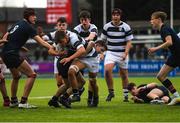 10 February 2023; Alex Clarke of Belvedere College is tackled by Facthna Spain of Wesley College during the Bank of Ireland Leinster Rugby Schools Junior Cup First Round match between Wesley College and Belvedere College at Energia Park in Dublin. Photo by Colm Kelly Morris/Sportsfile