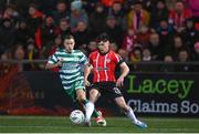 10 February 2023; Adam O'Reilly of Derry City in action against Liam Burt of Shamrock Rovers during the President's Cup match between Derry City and Shamrock Rovers at the Ryan McBride Brandywell Stadium in Derry. Photo by Stephen McCarthy/Sportsfile