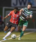 10 February 2023; Sadou Diallo of Derry City in action against Richie Towell of Shamrock Rovers during the President's Cup match between Derry City and Shamrock Rovers at the Ryan McBride Brandywell Stadium in Derry.  Photo by Stephen McCarthy/Sportsfile