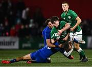 10 February 2023; James Nicholson of Ireland is tackled by Nicolas Depoortere, left, and Léo Carbonneau of France during the U20 Six Nations Rugby Championship match between Ireland and France at Musgrave Park in Cork. Photo by Eóin Noonan/Sportsfile