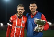 10 February 2023; Jamie McGonigle, left, and Cian Kavanagh of Derry City with the President's Cup after the President's Cup match between Derry City and Shamrock Rovers at the Ryan McBride Brandywell Stadium in Derry. Photo by Stephen McCarthy/Sportsfile