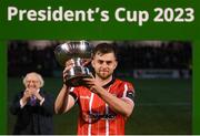 10 February 2023; Derry City captain Will Patching lifts the President's Cup after the President's Cup match between Derry City and Shamrock Rovers at the Ryan McBride Brandywell Stadium in Derry. Photo by Stephen McCarthy/Sportsfile