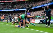 11 February 2023; James Lowe of Ireland scores his side's second try despite the tackle of Damian Penaud of France during the Guinness Six Nations Rugby Championship match between Ireland and France at the Aviva Stadium in Dublin.  Photo by Brendan Moran/Sportsfile