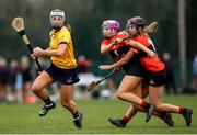 11 February 2023; Niamh Deely of DCU geta away from the tackle of Meadhbh Ring, and Ciara O'Sullivan of UCC during the Electric Ireland Ashbourne Cup Semi Final between UCC and DCU at UCD in Dublin. Photo by Michael P Ryan/Sportsfile