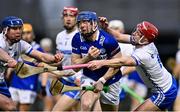 11 February 2023; Stephen Maher of Laois in action against Conor Prunty, left, and Calum Lyons of Waterford of Waterford during the Allianz Hurling League Division 1 Group B match between Laois and Waterford at Laois Hire O'Moore Park in Portlaoise, Laois. Photo by Piaras Ó Mídheach/Sportsfile