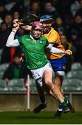11 February 2023; Shane O'Brien of Limerick is tackled by David McInerney of Clare during the Allianz Hurling League Division 1 Group A match between Limerick and Clare at TUS Gaelic Grounds in Limerick. Photo by Eóin Noonan/Sportsfile