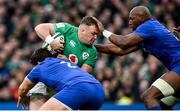 11 February 2023; Dave Kilcoyne of Ireland is tackled by Julien Marchand, left, and Sekou Macalou of France during the Guinness Six Nations Rugby Championship match between Ireland and France at the Aviva Stadium in Dublin. Photo by Seb Daly/Sportsfile
