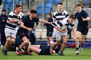 10 February 2023; Ryan Grant of Belvedere College is tackled by Tom Burke, bottom, and Charlie Simmons of Wesley College during the Bank of Ireland Leinster Rugby Schools Junior Cup First Round match between Wesley College and Belvedere College at Energia Park in Dublin. Photo by Tyler Miller/Sportsfile