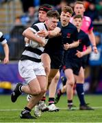 10 February 2023; Ryan Grant of Belvedere College is tackled by Isaac Reid of Wesley College during the Bank of Ireland Leinster Rugby Schools Junior Cup First Round match between Wesley College and Belvedere College at Energia Park in Dublin. Photo by Tyler Miller/Sportsfile