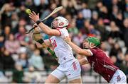 12 February 2023; Declan Dalton of Cork scores a point, under pressure from Jack Grealish of Galway, during the Allianz Hurling League Division 1 Group A match between Galway and Cork at Pearse Stadium in Galway. Photo by Seb Daly/Sportsfile