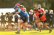 12 February 2023; Kerrie Finnegan of TUD in action against Clodagh Carroll, hidden, and Meabh Murphy of UCC during the Electric Ireland Ashbourne Cup Final between UCC and TUD at UCD in Dublin. Photo by Ben McShane/Sportsfile
