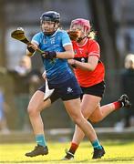 12 February 2023; Kerrie Finnegan of TUD in action against Clodagh Carroll of UCC during the Electric Ireland Ashbourne Cup Final between UCC and TUD at UCD in Dublin. Photo by Ben McShane/Sportsfile